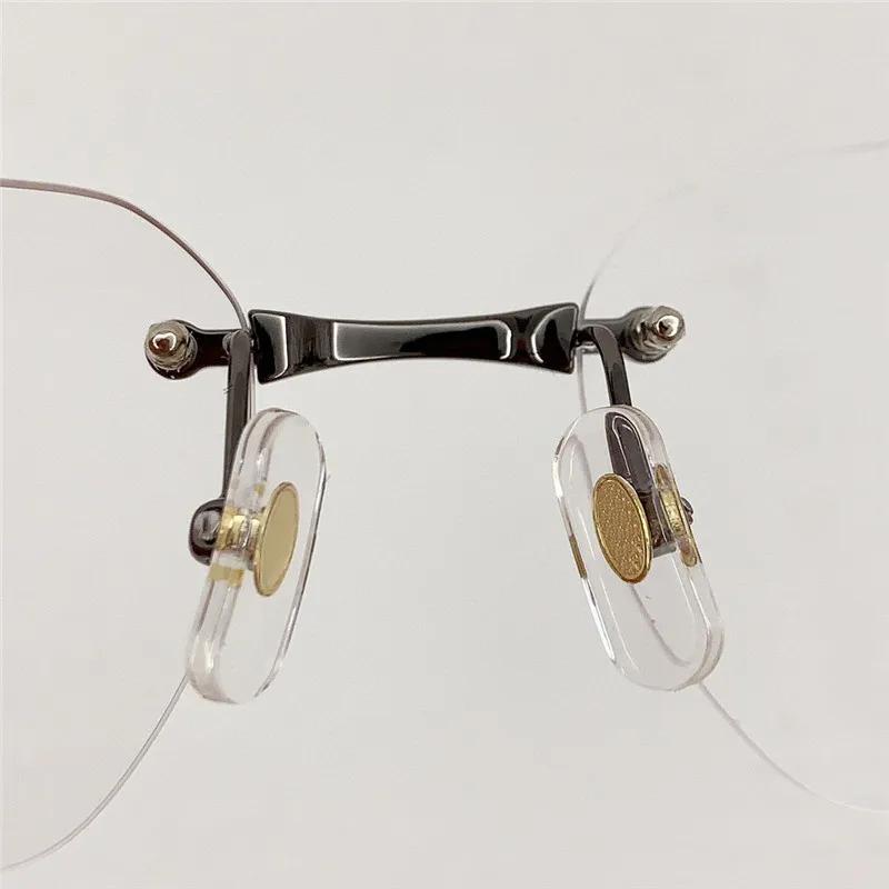 Nuevos gafas ópticas de diseño de moda 0407 Rimless K Gold Frame Forma retro Simple y elegante Las gafas versátiles con caja pue